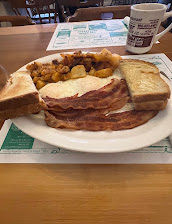 3 Eggs Over Easy Home Fries Bacon And Toast