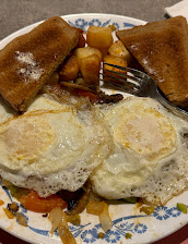 Grilled Veggies And Home Fries With Two Eggs On Top