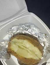 Baked Potato With Butter And Sour Cream On Side