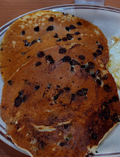 Chocolate Chip Pancakes And Over Easy Egg